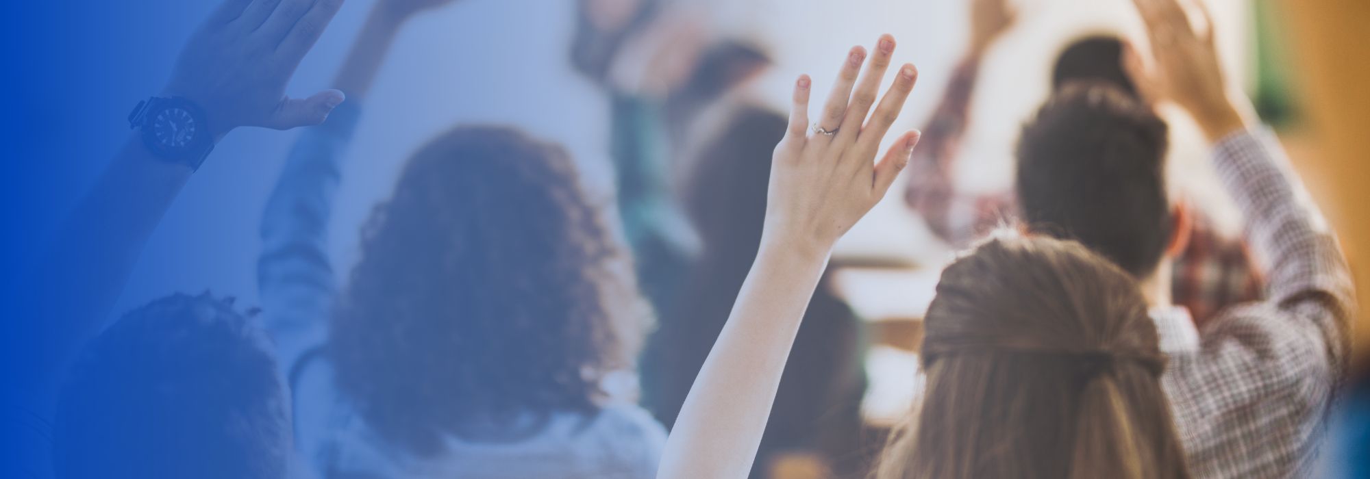 hands raised behind blue background