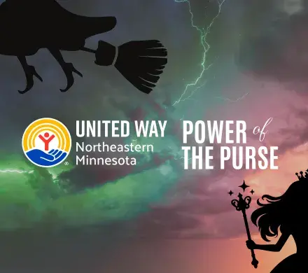 Green and pink lit sky with silhouettes of the wicked witch and Glinda. In foreground, UWNEMN Power of the Purse.