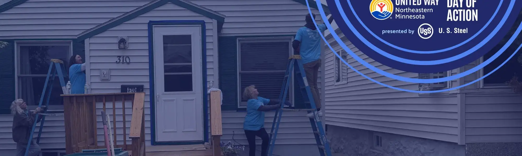 volunteers paint a house for Day of Action 