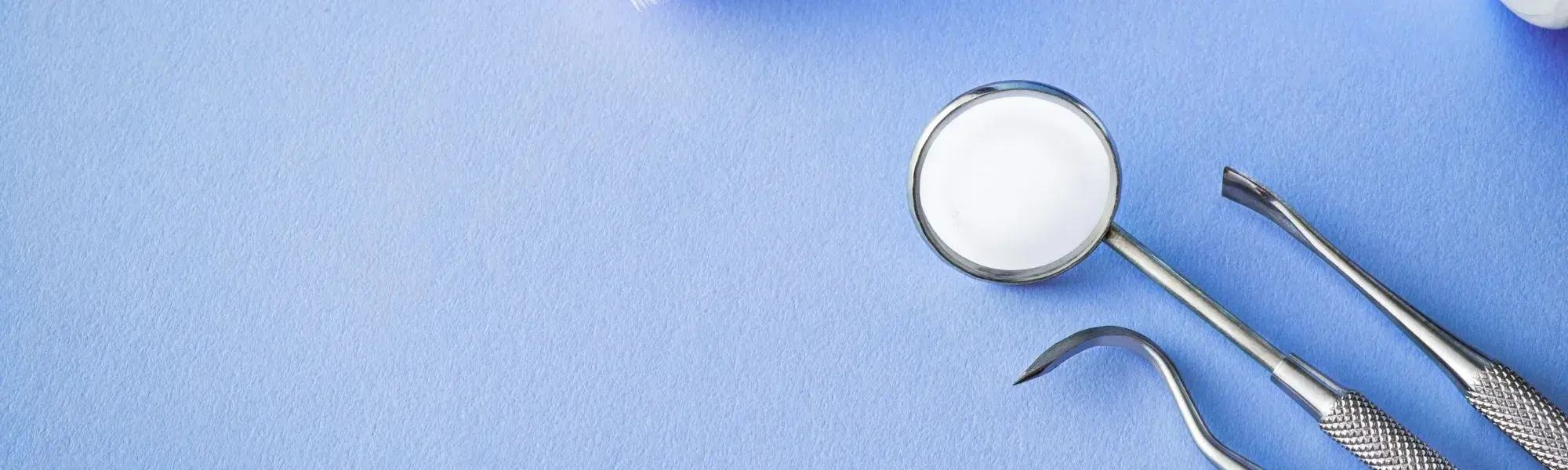 dental tools on a blue background