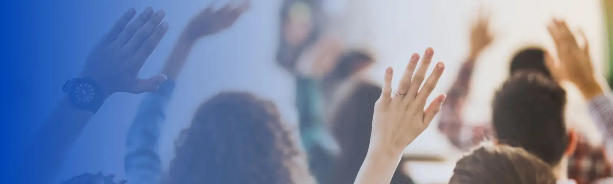 hands raised behind blue background
