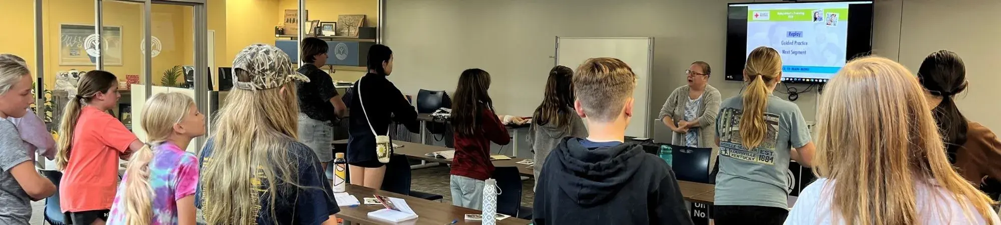 Students participate in Red Cross babysitter training at UWNEMN's building