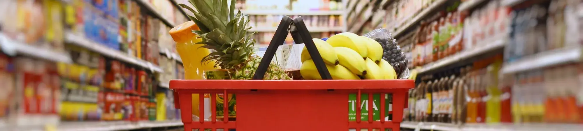 basket full of groceries in middle of aisle