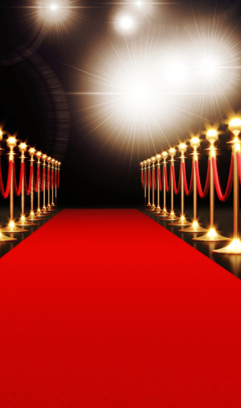 Red carpet and flashing lights with red ticket image that reads: "Get your ticket today for a Night at the Movies themed event to benefit Imagination Library"