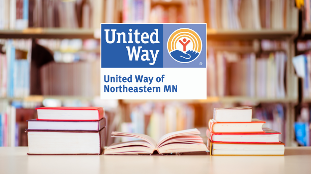 Photo of library - background is blurred, and in foreground is three stacks of books - United Way of Northeastern Minnesota logo hovers over books