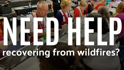 volunteers help disaster survivors at a MARC (in front, text reads NEED HELP recovering from wildfires?)