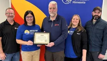 American Red Cross Executive Director Dan Williams (left), UWNEMN Executive Director Erin Shay, MN Department of Public Safety Regional Program Coordinator Kelvin McCuskey, UWNEMN Volunteer and Engagement Coordinator Emily Unhjem, and St. Louis County Emergency Management Coordinator Josh Brinkman pose with DPS award presented to UWNEMN for their work assisting with 2025 wildfire recovery in St. Louis County