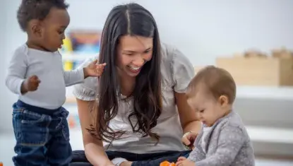 Image of childcare worker and children